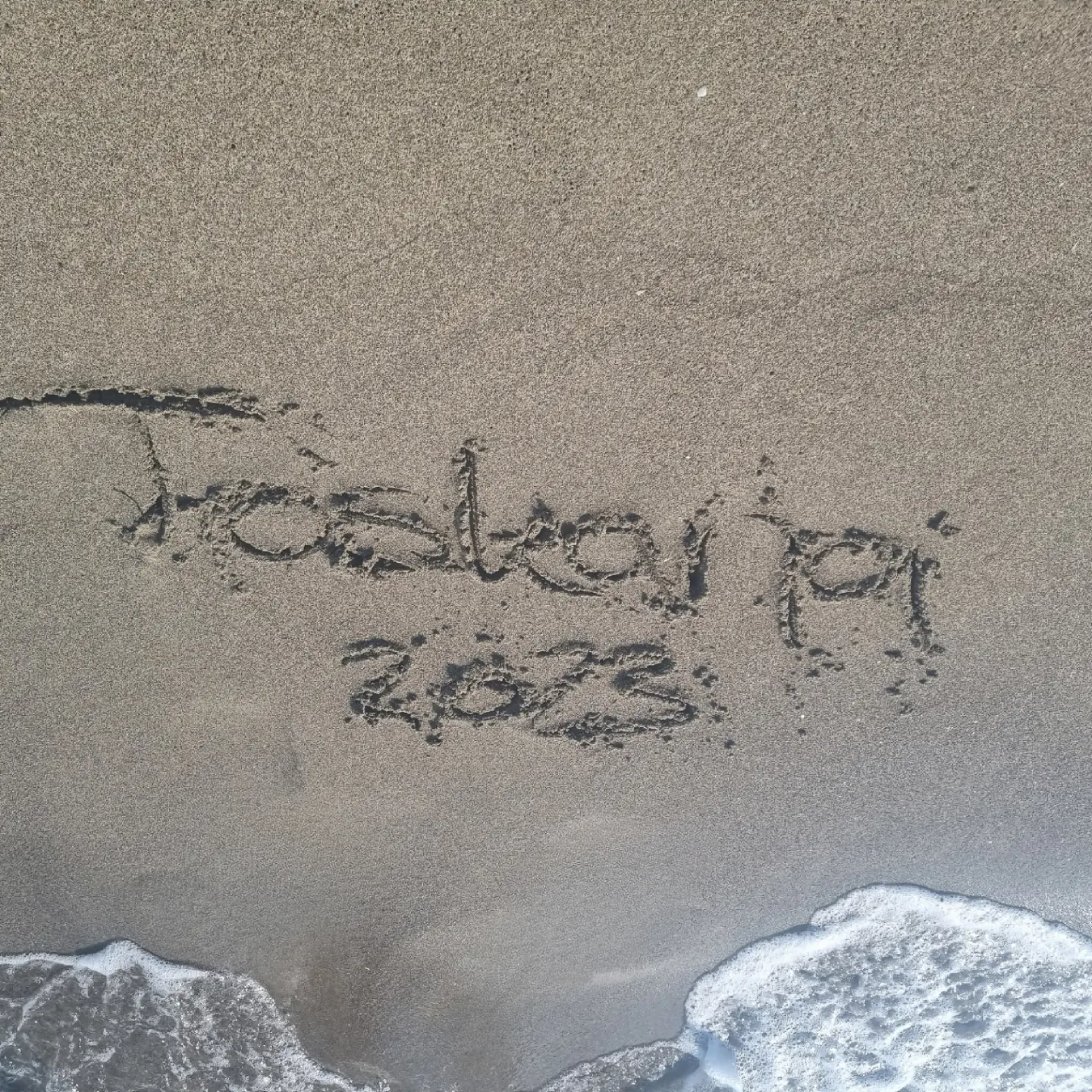 Schriftzug im Sand